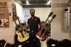 Greg Voros from Gruhns Guitars with 2 Gibson Doublenecks